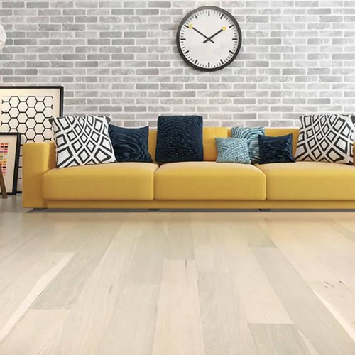 deep seated yellow sofa with bright color pillows | Serving Northern Colorado | 970-352-7251 |