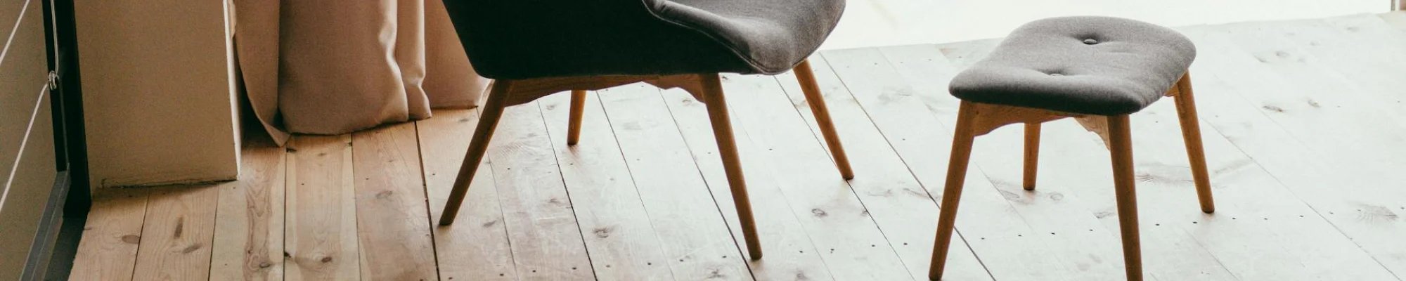 chic chair and ottoman on beautiful wood floor | Mitchell's Flooring & Design | Serving Northern Colorado | 70-352-7251 |