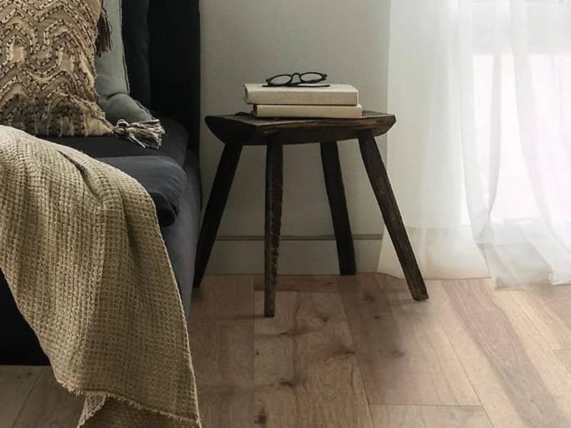 hardwood flooring with small side table | Mitchell's Flooring & Design | Serving Northern Colorado | 70-352-7251 |