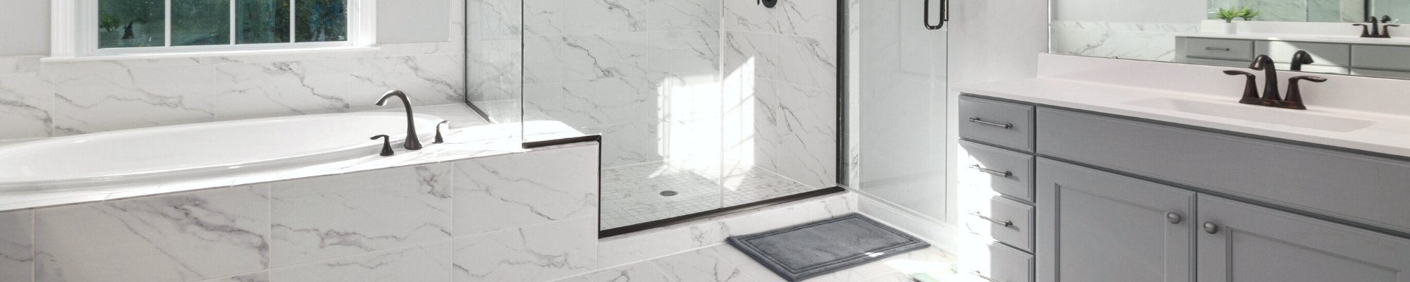 transitional style bathroom with grey vanity and marble porcelain tile flooring | Northern Colorado | 970-352-7251 |