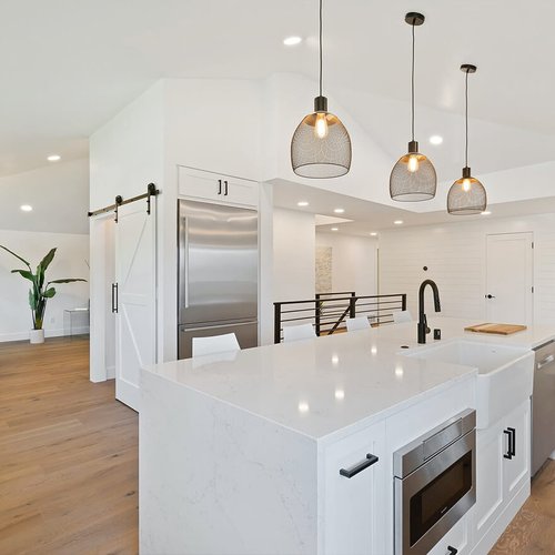 water resistant laminate floors in white kitchen | Serving Northern Colorado | 970-352-7251 |