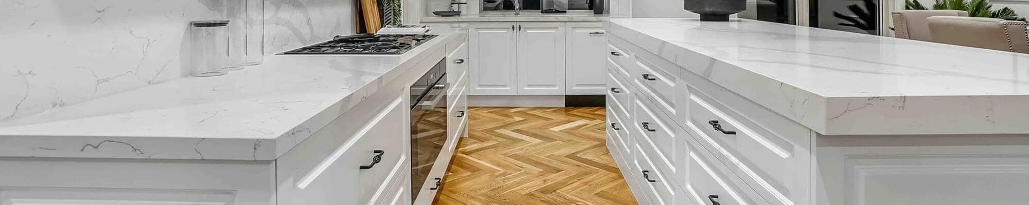 white kitchen with white marble countertops | Mitchell's Flooring & Design | Serving Northern Colorado | 970-352-7251 |